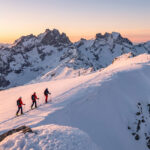 Skiers navigating the glaciers of Écrins during the Grande Ruine raid